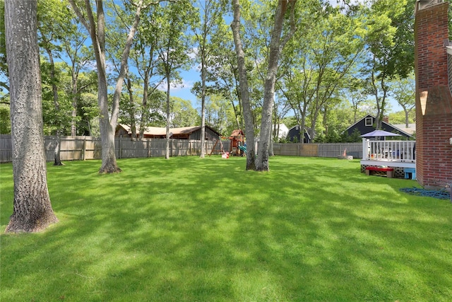 75 Lynncliff Rd, Hampton Bays, NY 11946 - fenced backyard with a playground