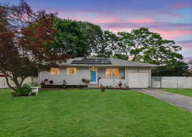 237 Donald Blvd, Holbrook, NY 11741 - view of front facade with driveway, a garage, and solar panels