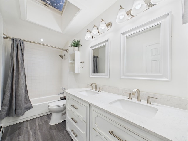 237 Donald Blvd, Holbrook, NY 11741 - full bath featuring double vanity, a skylight, wood finished floors, and shower / bath combo with shower curtain