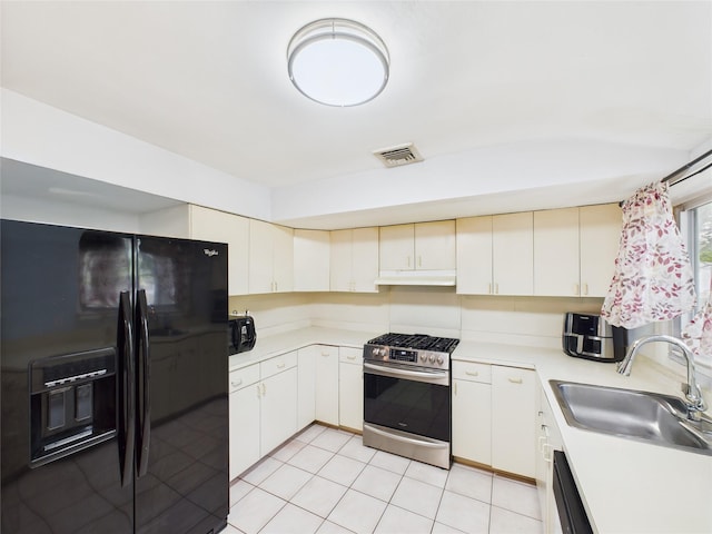 237 Donald Blvd, Holbrook, NY 11741 - kitchen with black appliances, under cabinet range hood, light countertops, and light tile patterned floors