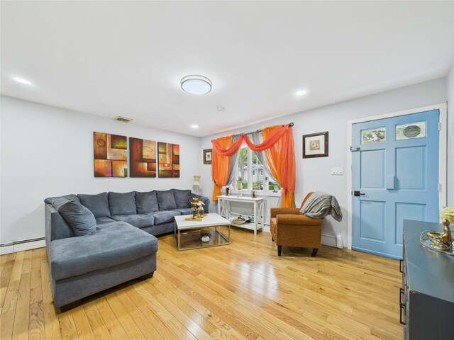 237 Donald Blvd, Holbrook, NY 11741 - living room with light wood-style flooring, recessed lighting, and a baseboard heating unit