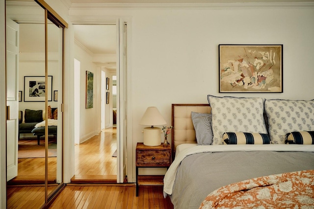 169 Mountain Rd, Cornwall On Hudson, NY 12520 - bedroom featuring hardwood / wood-style floors, ornamental molding, and a closet