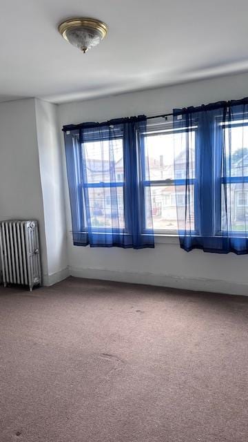 9331 207th St, Queens Village, NY 11428 - spare room with radiator, healthy amount of natural light, and carpet floors