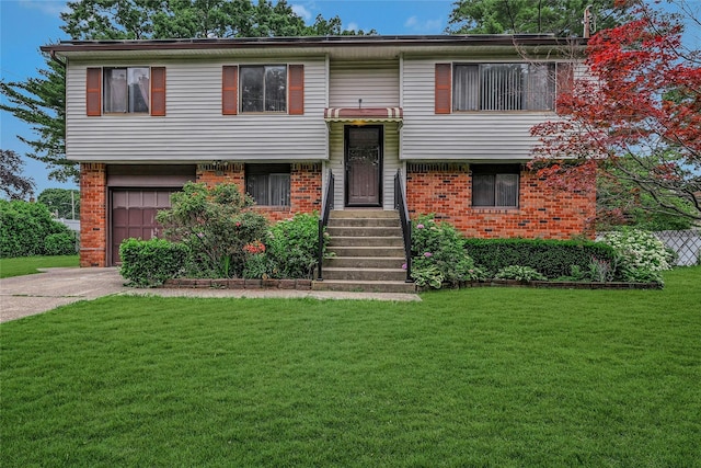 103 Lakeway Dr, West Babylon, NY 11704 - raised ranch with a garage, brick siding, concrete driveway, and a front lawn