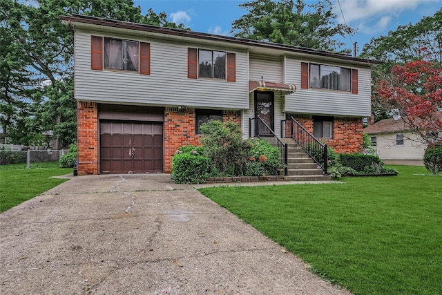 103 Lakeway Dr, West Babylon, NY 11704 - split foyer home featuring brick siding, a garage, and driveway