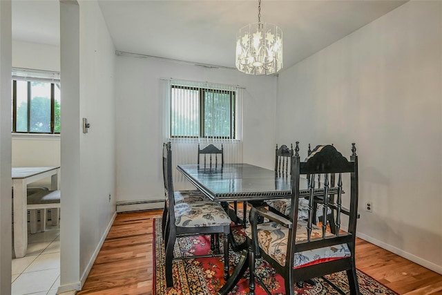 103 Lakeway Dr, West Babylon, NY 11704 - dining room with a chandelier, light wood-style floors, and baseboard heating