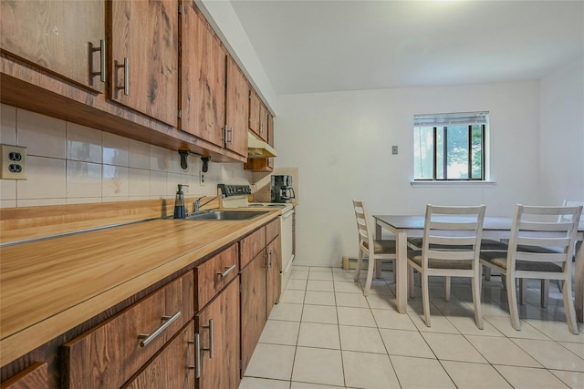 103 Lakeway Dr, West Babylon, NY 11704 - kitchen with white range with electric cooktop, decorative backsplash, light tile patterned floors, brown cabinetry, and light countertops