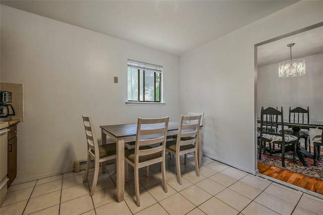 103 Lakeway Dr, West Babylon, NY 11704 - dining space with a chandelier and light tile patterned floors
