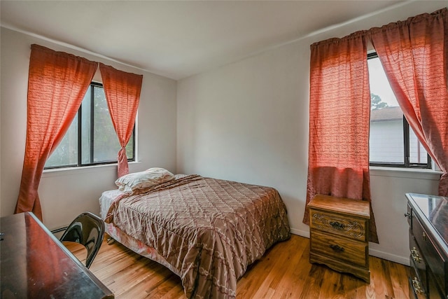103 Lakeway Dr, West Babylon, NY 11704 - bedroom with wood finished floors and baseboards