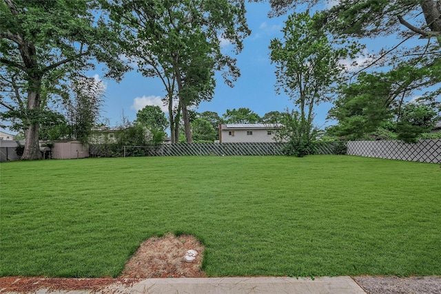 103 Lakeway Dr, West Babylon, NY 11704 - fenced backyard featuring a storage shed