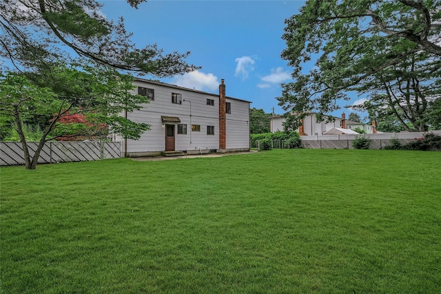 103 Lakeway Dr, West Babylon, NY 11704 - back of house with a chimney