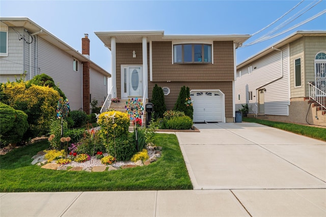 179 Alice Ave, Oceanside, NY 11572 - view of front of home featuring an attached garage and driveway
