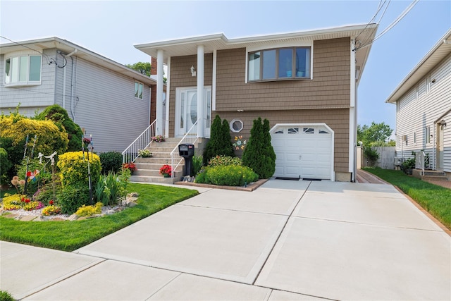 179 Alice Ave, Oceanside, NY 11572 - split foyer home featuring an attached garage and driveway