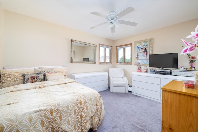 179 Alice Ave, Oceanside, NY 11572 - bedroom with light colored carpet, a baseboard heating unit, and ceiling fan