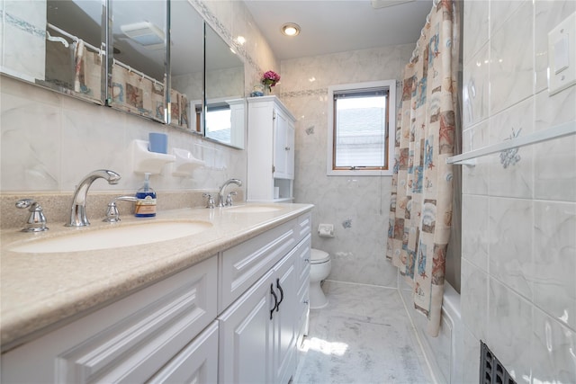 179 Alice Ave, Oceanside, NY 11572 - full bath featuring tile walls, double vanity, and shower / bath combo