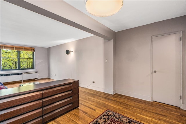 139-15 83rd Ave Unit 520, Briarwood, NY 11435 - bar with wood finished floors and radiator heating unit