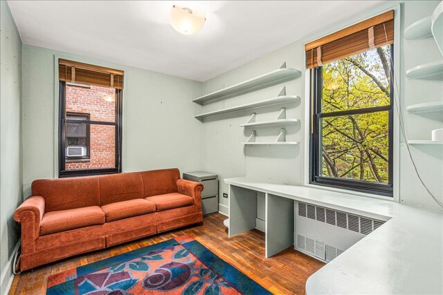 139-15 83rd Ave Unit 520, Briarwood, NY 11435 - living area with radiator heating unit and wood finished floors