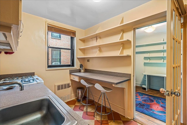 139-15 83rd Ave Unit 520, Briarwood, NY 11435 - washroom with radiator heating unit and baseboards