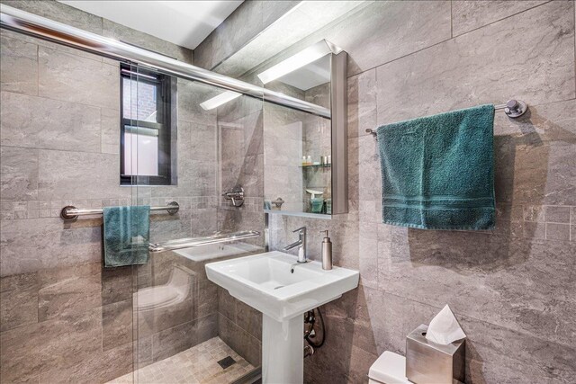139-15 83rd Ave Unit 520, Briarwood, NY 11435 - full bath with tiled shower and tile walls