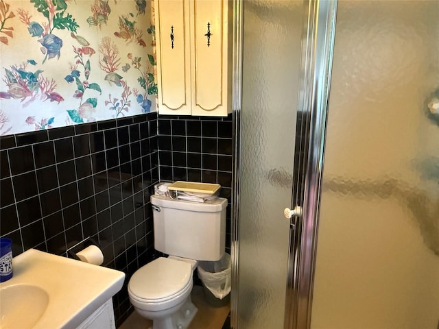 761 Barkley Ave, East Meadow, NY 11554 - bathroom with a stall shower, tile walls, vanity, and a wainscoted wall