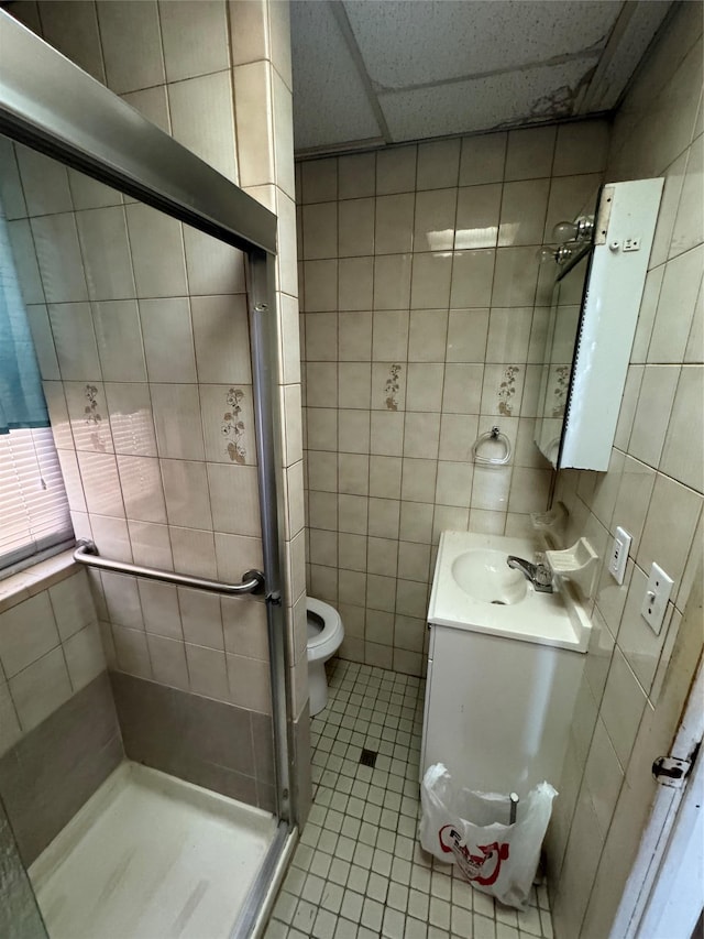 107-03 32nd Ave, East Elmhurst, NY 11369 - full bath featuring tile walls, vanity, tile patterned flooring, and a shower stall