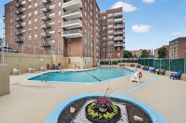355 Bronx River Rd Unit 4B, Yonkers, NY 10704 - community pool featuring a patio area