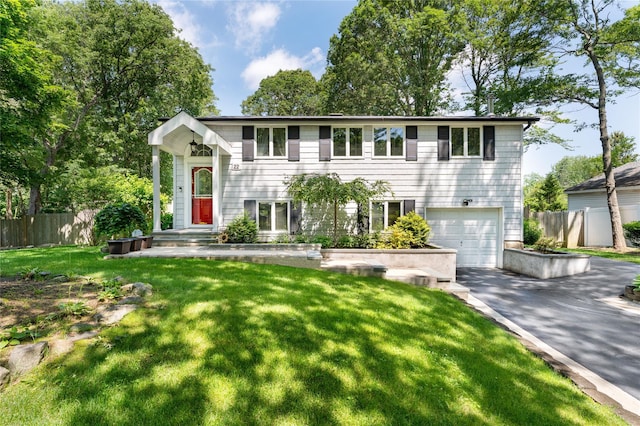 22 Woodchuck Ln, East Setauket, NY 11733 - view of front of home featuring asphalt driveway and a garage