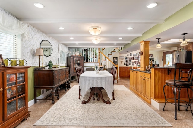 22 Woodchuck Ln, East Setauket, NY 11733 - dining space featuring wallpapered walls, plenty of natural light, stairway, beamed ceiling, and recessed lighting