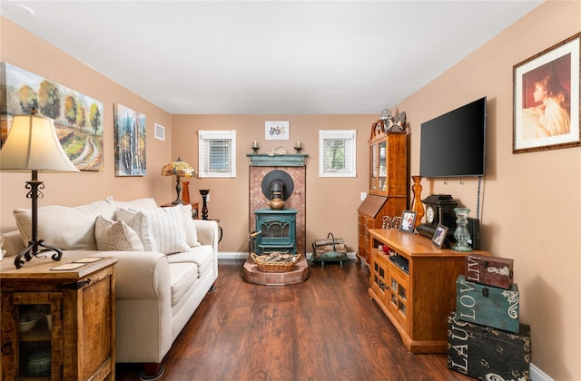 22 Woodchuck Ln, East Setauket, NY 11733 - living room with dark wood-style flooring and a wood stove