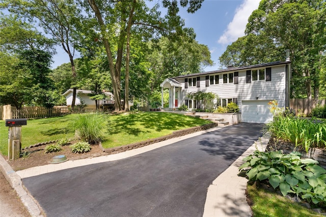 22 Woodchuck Ln, East Setauket, NY 11733 - colonial-style house featuring driveway and a garage