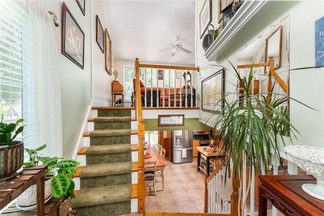 22 Woodchuck Ln, East Setauket, NY 11733 - staircase with ceiling fan, healthy amount of natural light, and tile patterned floors