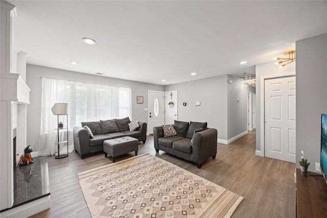 16 Melvin Ave, Farmingville, NY 11738 - living area featuring wood finished floors and recessed lighting