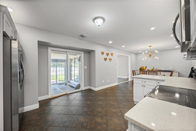 16 Melvin Ave, Farmingville, NY 11738 - kitchen featuring stainless steel appliances, white cabinetry, recessed lighting, a chandelier, and hanging light fixtures