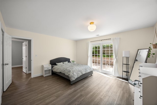 16 Melvin Ave, Farmingville, NY 11738 - bedroom with dark wood-type flooring and access to exterior
