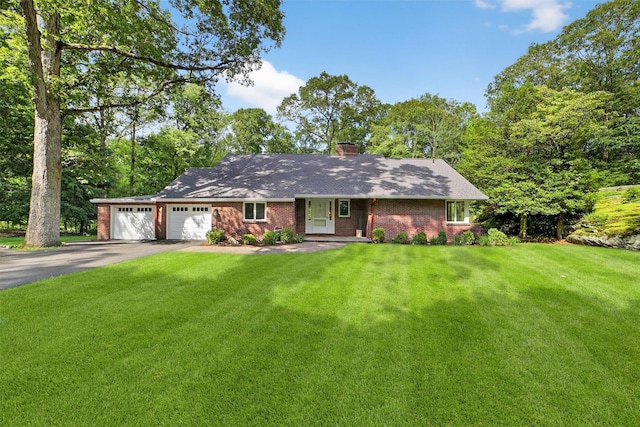 294 Colonel Greene Rd, Yorktown Heights, NY 10598 - single story home featuring asphalt driveway, brick siding, an attached garage, and a front lawn