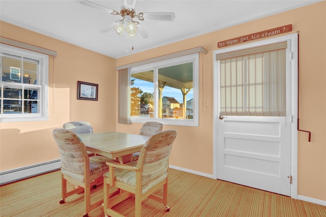 138 Sequams Ln E, West Islip, NY 11795 - dining space featuring light colored carpet, a baseboard heating unit, and a ceiling fan