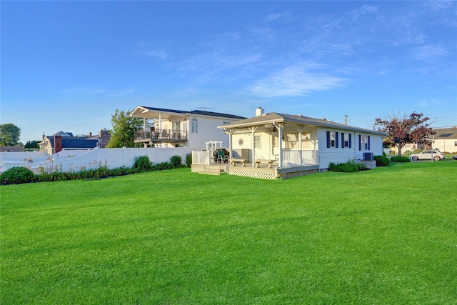 138 Sequams Ln E, West Islip, NY 11795 - rear view of property with a sunroom and a deck