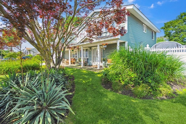 17 Sterling Dr, Lake Grove, NY 11755 - rear view of house with a yard and a porch