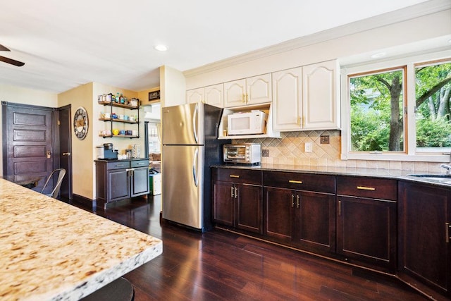 17 Sterling Dr, Lake Grove, NY 11755 - kitchen with freestanding refrigerator, white microwave, dark wood finished floors, backsplash, and ceiling fan