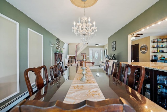17 Sterling Dr, Lake Grove, NY 11755 - dining room featuring stairs, a chandelier, and a baseboard radiator