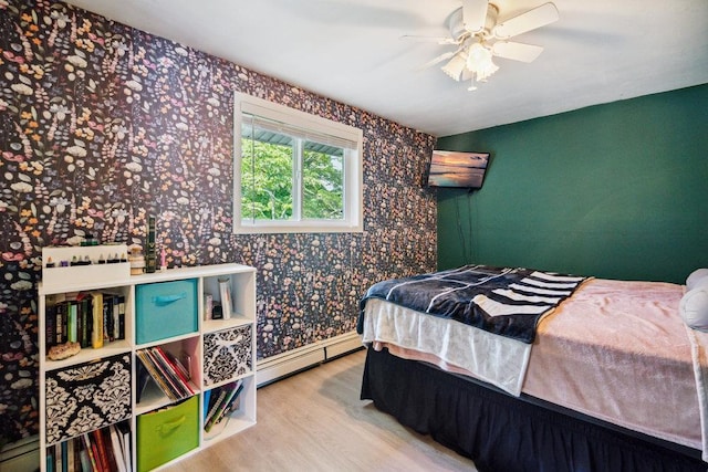17 Sterling Dr, Lake Grove, NY 11755 - bedroom featuring a baseboard radiator, wallpapered walls, wood finished floors, and ceiling fan