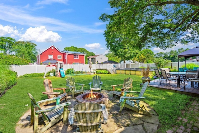 17 Sterling Dr, Lake Grove, NY 11755 - fenced backyard featuring an outdoor fire pit, a playground, a patio area, and a gazebo