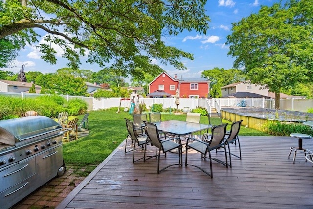17 Sterling Dr, Lake Grove, NY 11755 - wooden terrace with a playground, outdoor dining space, a fenced backyard, and grilling area