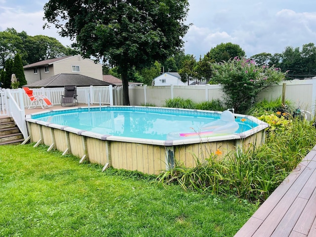17 Sterling Dr, Lake Grove, NY 11755 - view of swimming pool featuring a deck and a fenced backyard