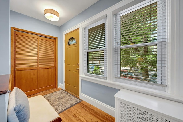 2524 Mickle Ave, Bronx, NY 10469 - foyer entrance with light wood-type flooring and radiator