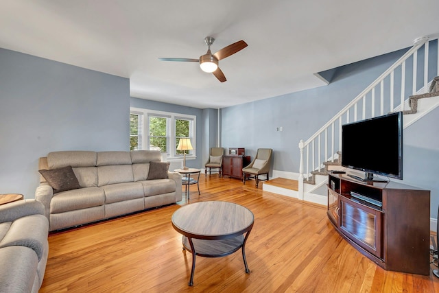 2524 Mickle Ave, Bronx, NY 10469 - living area featuring stairs, light wood-style flooring, and ceiling fan