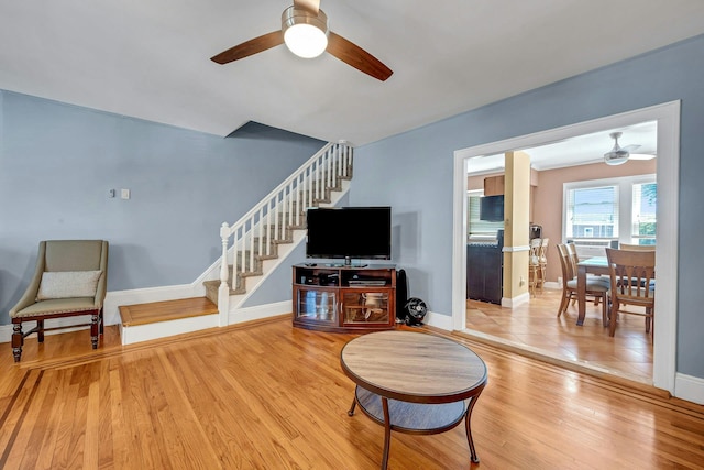 2524 Mickle Ave, Bronx, NY 10469 - living area with a ceiling fan, stairway, and wood finished floors