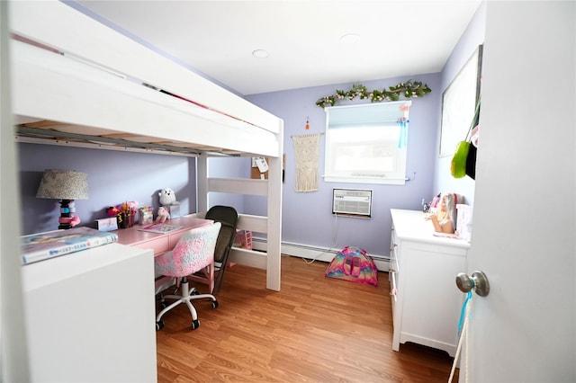 184 Sumpwams Ave, Babylon, NY 11702 - bedroom featuring light wood-style flooring, a baseboard radiator, a wall unit AC, an office area, and recessed lighting