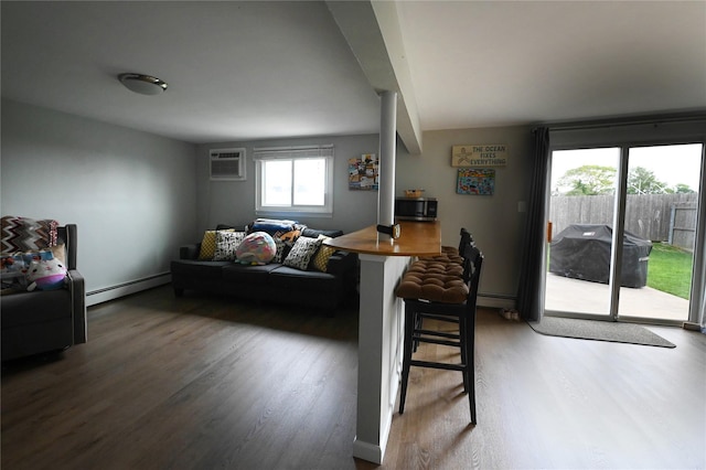 184 Sumpwams Ave, Babylon, NY 11702 - living room with a baseboard radiator, wood finished floors, and a wall mounted AC