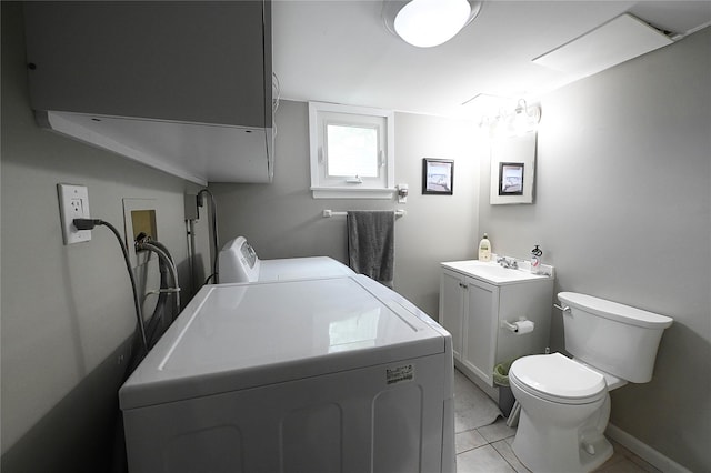 184 Sumpwams Ave, Babylon, NY 11702 - bathroom with washer and dryer, tile patterned flooring, and vanity